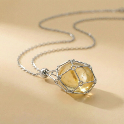 Colgante piedra natural en Jaula | Diseño Geométrico Minimalista de Acero Inoxidable