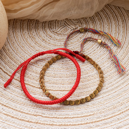 Handcrafted Tibetan Buddhist bracelet with vintage bronze charms